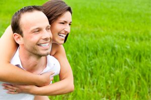 Smiling Couple On Grass