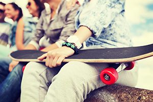 Teenager Holding a Skateboard