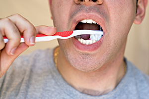 Man Brushing His Teeth